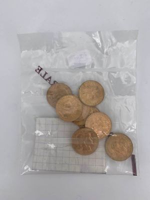 a bag of coins sitting on top of a table