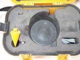 a yellow case with a black lid and a yellow handle
