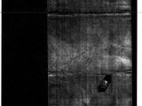 an image of a black and white photo of a piece of paper with a hole in it