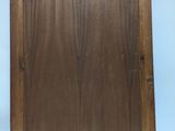 a picture of a wooden frame hanging on the wall