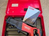 the tools are in the red case on the concrete floor