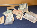 a pile of old paper money sitting on a blue table