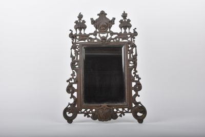 an antique mirror with ornate design on a white background