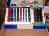 a box with a bunch of different colored hair clips in it