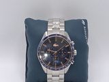 the watch is sitting on a pillow on a white surface