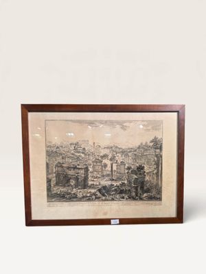 an old picture of a picture of a city in a wooden frame