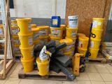 a pile of yellow barrels sitting on top of a pallet