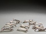 a lot of silver animal figurines sitting on a table