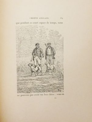 un vieux livre sur lequel figure le dessin de deux hommes et d'un chien