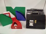 a black briefcase sitting on a table next to other items