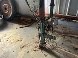 a machine that is sitting on the floor in a garage
