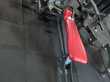 a bike that is sitting on the floor in the gym