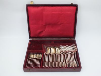 a red case with silverware in it on a white surface