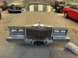 a car that is parked in a garage next to other cars