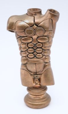 a bronze statue of a male torso on a pedestal