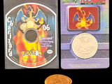 a coin sitting next to a game disc on a table