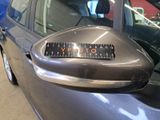 an image of a car door mirror with the name of the company