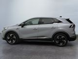 the rear end of a silver suv parked on a concrete floor
