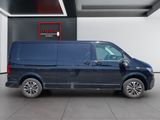 the blue van is parked in a large room with a sign on the wall