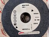 a close up of a grinding wheel on a piece of paper