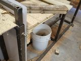 a picture of a workbench with a bucket of wood