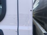 a close up of a white truck with a window