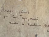 a piece of wood that has writing on it