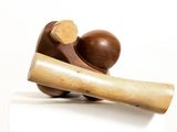 a wooden object that is sitting on top of a block