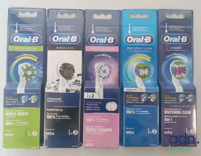 several toothbrushes are lined up in a row on a table