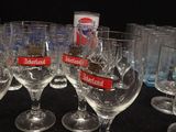 several empty wine glasses are lined up on a black table