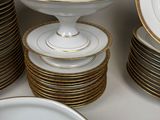 a lot of plates and bowls stacked on top of each other
