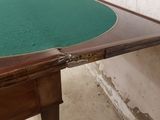 a table that has a green cloth on top of it