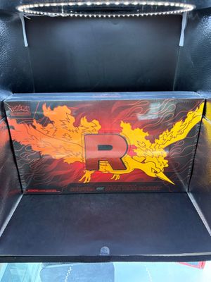 a close up of a bbq grill with a dragon painted on it