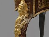 a small table with a gold decoration on it