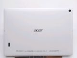 the back of a white tablet computer sitting on top of a table