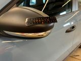 a close up of a car ' s side mirror with a sticker on it