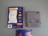 a video game on the table next to the box