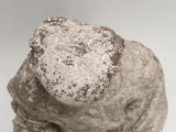 a rock that is sitting on top of a white table