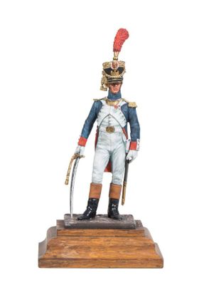 figurine of a soldier in uniform with a sword on a wooden base