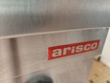 a close up of a machine with a red sticker on it