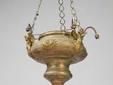 an image of a brass hanging light fixture with a bird on it