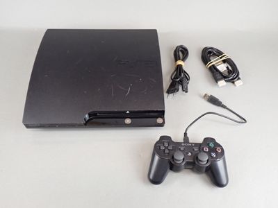 a video game console and a charger on the table