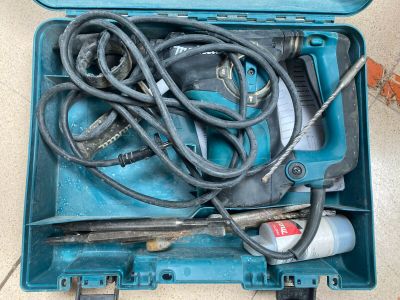 a blue tool box with tools in it on the floor