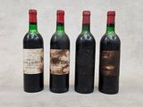 trois bouteilles de vin sont posées l'une à côté de l'autre sur une table