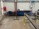 a picture of a factory with tables and benches