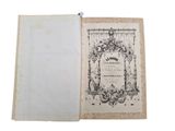 an old book opened to show a page with a picture on it
