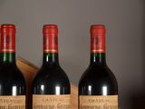 three bottles of wine that are sitting on a table