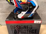 a helmet on top of a box on a table