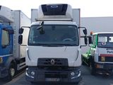 two trucks that are parked in a parking lot