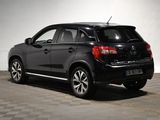 a picture of a black car parked in a garage